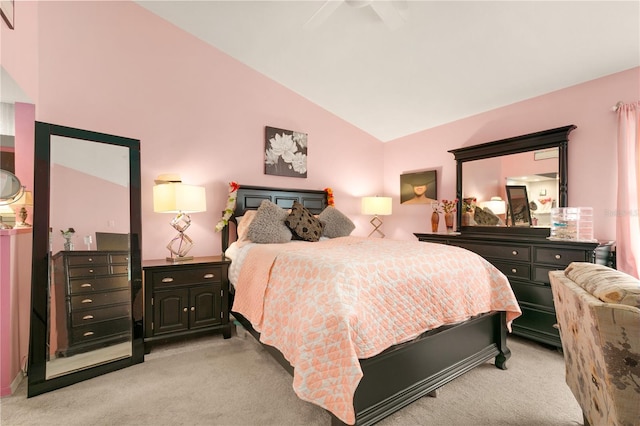 carpeted bedroom featuring ceiling fan and high vaulted ceiling