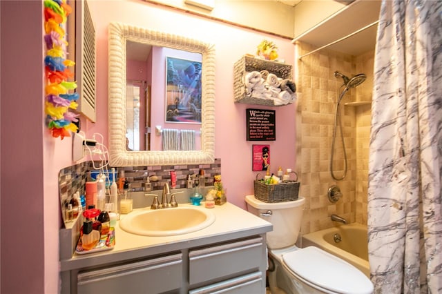 full bathroom with vanity, toilet, and shower / bath combo with shower curtain