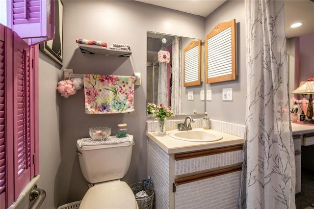 bathroom with vanity and toilet