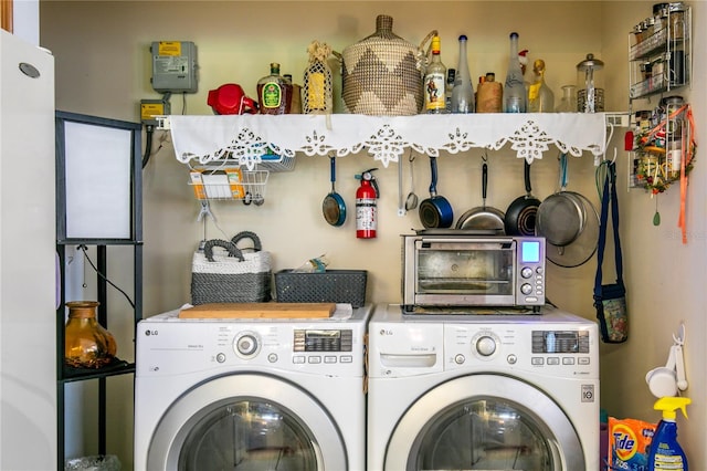 washroom with independent washer and dryer