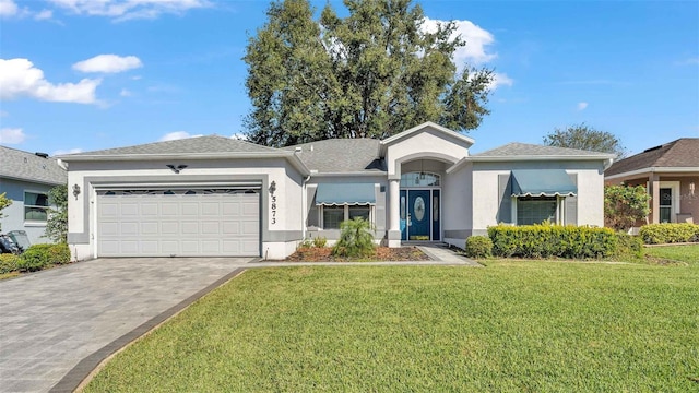 single story home featuring a front yard and a garage