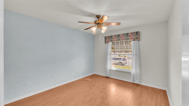 spare room featuring hardwood / wood-style floors, a textured ceiling, and ceiling fan