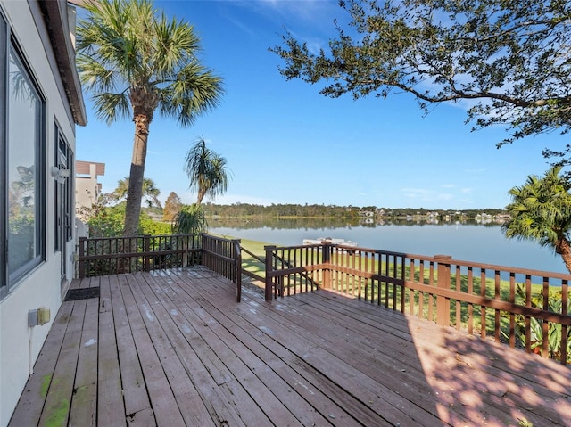 wooden deck featuring a water view