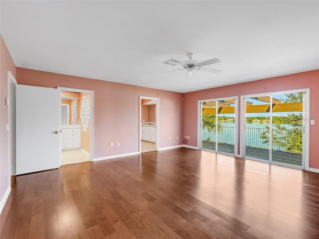 unfurnished room with ceiling fan and light hardwood / wood-style flooring