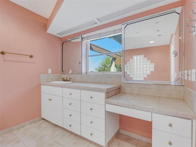 bathroom featuring tile patterned flooring and vanity