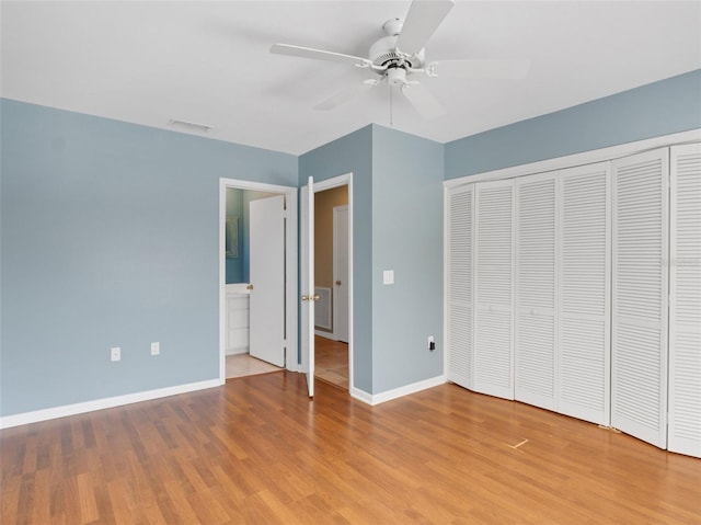 unfurnished bedroom with ceiling fan, a closet, and light hardwood / wood-style floors