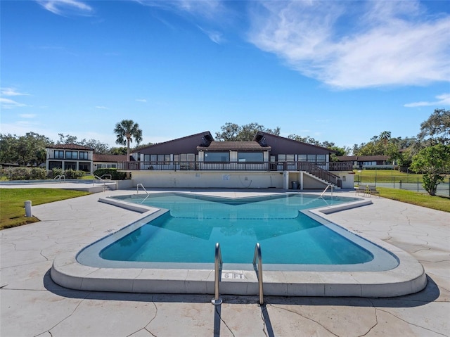 view of swimming pool with a patio