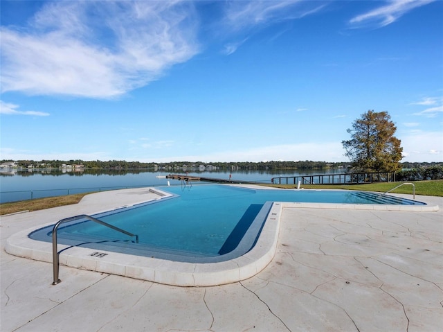 view of pool featuring a water view