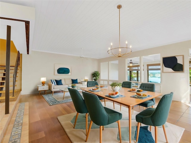 dining area with wooden ceiling, light hardwood / wood-style floors, and ceiling fan with notable chandelier