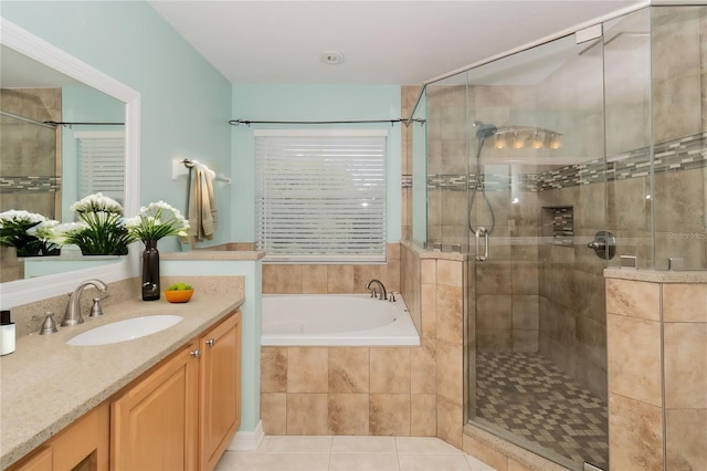7018 Cascades Ct, Lakeland, FL 33813 - full bathroom featuring a shower stall, vanity, a bath, and tile patterned floors