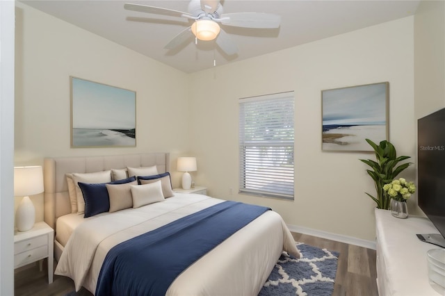 bedroom featuring ceiling fan and dark wood-type flooring