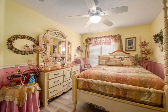 bedroom featuring ceiling fan and light wood-type flooring