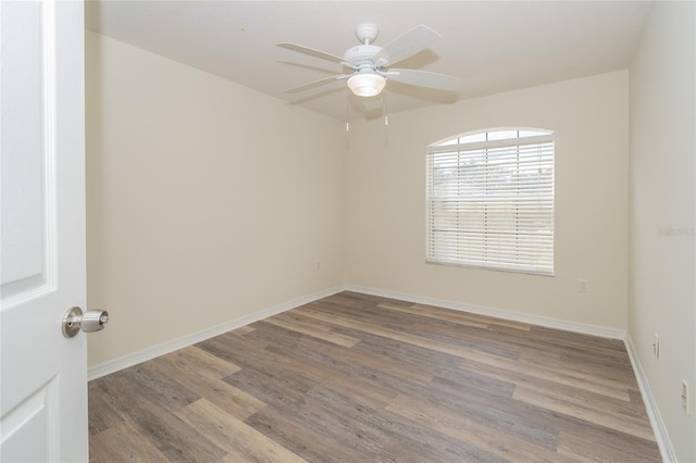 spare room with ceiling fan and light hardwood / wood-style flooring