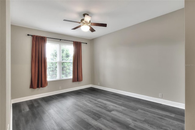 unfurnished room with ceiling fan and dark hardwood / wood-style flooring