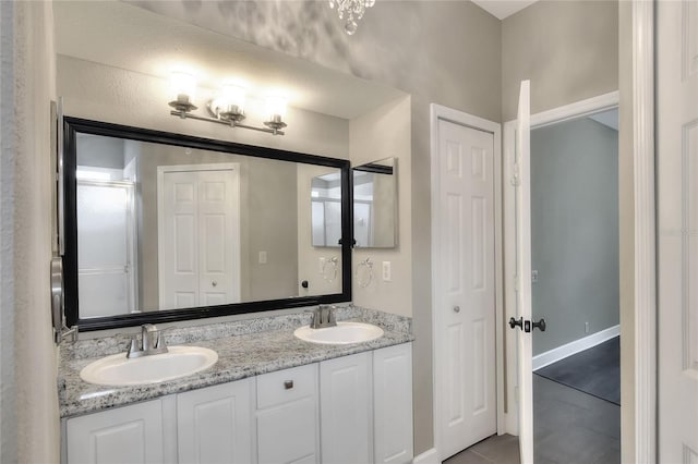 bathroom with tile patterned floors and vanity