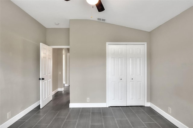 unfurnished bedroom with a closet, vaulted ceiling, and ceiling fan