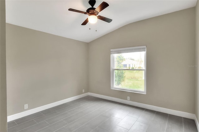 unfurnished room with ceiling fan and vaulted ceiling