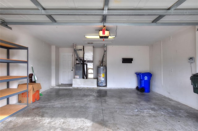 garage featuring heating unit, a garage door opener, and water heater