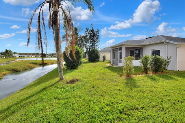 view of yard with a water view