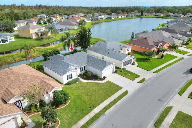 birds eye view of property with a water view