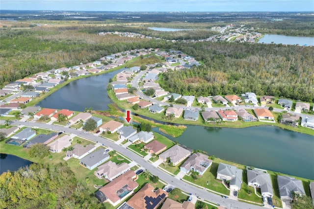 birds eye view of property featuring a water view