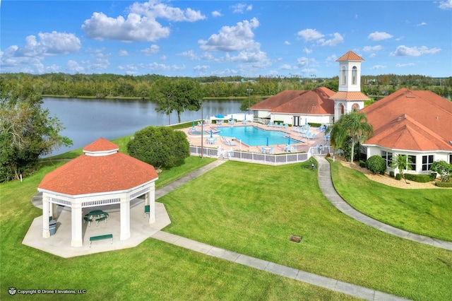 view of pool featuring a gazebo, a lawn, a water view, and a patio