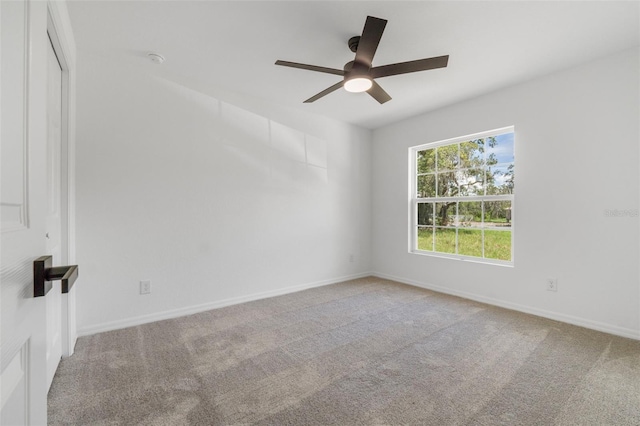 unfurnished room with ceiling fan and carpet floors