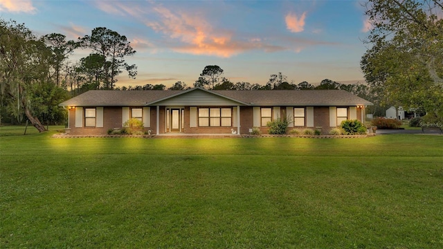 ranch-style house with a yard