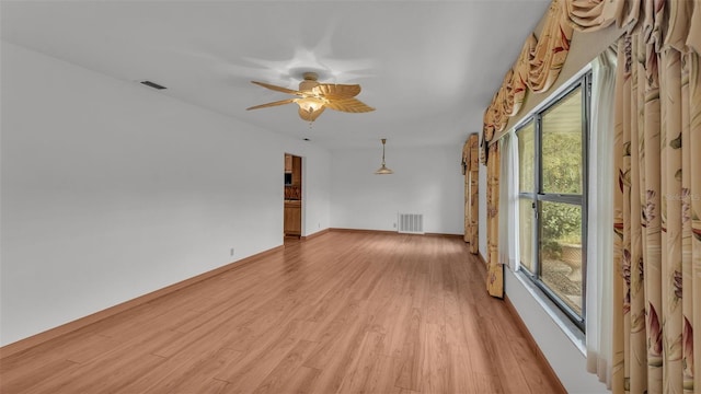 spare room with ceiling fan and light hardwood / wood-style flooring