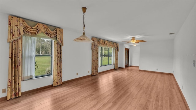 interior space featuring ceiling fan, plenty of natural light, and light wood-type flooring