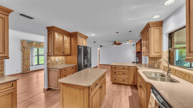 kitchen with ceiling fan, light hardwood / wood-style floors, sink, and appliances with stainless steel finishes