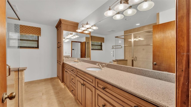9240 Moore Rd, Lakeland, FL 33809 - bathroom featuring a shower stall, double vanity, tile patterned flooring, baseboards, and a chandelier