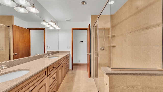 9240 Moore Rd, Lakeland, FL 33809 - full bath with double vanity, a stall shower, and tile patterned floors