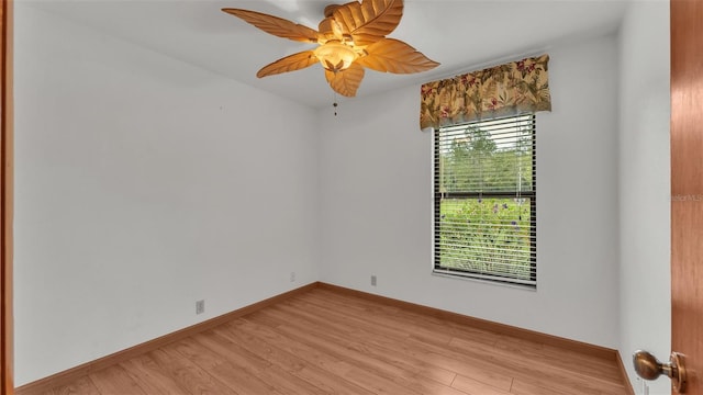 spare room featuring ceiling fan and light hardwood / wood-style floors