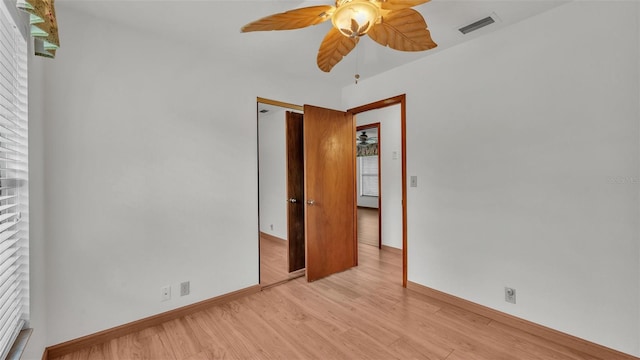 spare room featuring light hardwood / wood-style floors and ceiling fan