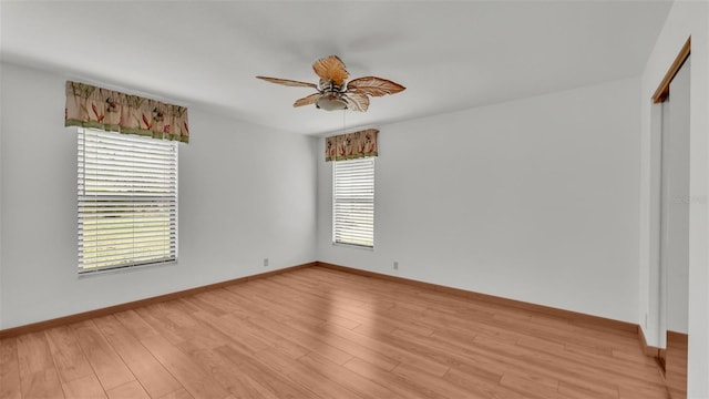 9240 Moore Rd, Lakeland, FL 33809 - empty room with a ceiling fan, light wood finished floors, and baseboards