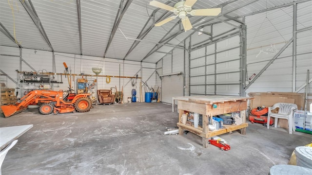 garage with a workshop area and ceiling fan