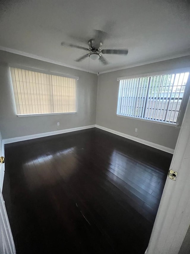 spare room featuring hardwood / wood-style flooring, ceiling fan, and ornamental molding