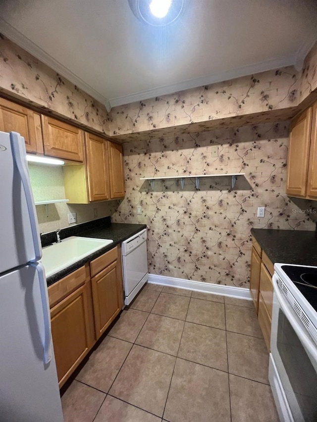 kitchen with crown molding, sink, light tile patterned floors, and white appliances