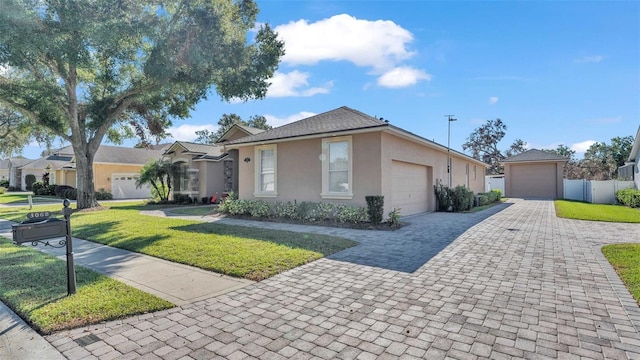 ranch-style house with a garage and a front yard