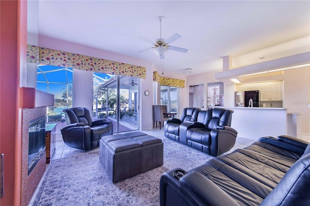 tiled living room with ceiling fan