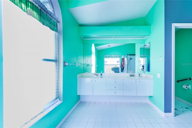 bathroom featuring vanity, tile patterned floors, and lofted ceiling