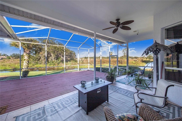 exterior space featuring ceiling fan and a lanai