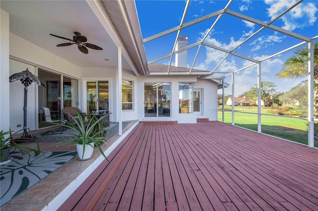 unfurnished sunroom with a wealth of natural light and ceiling fan