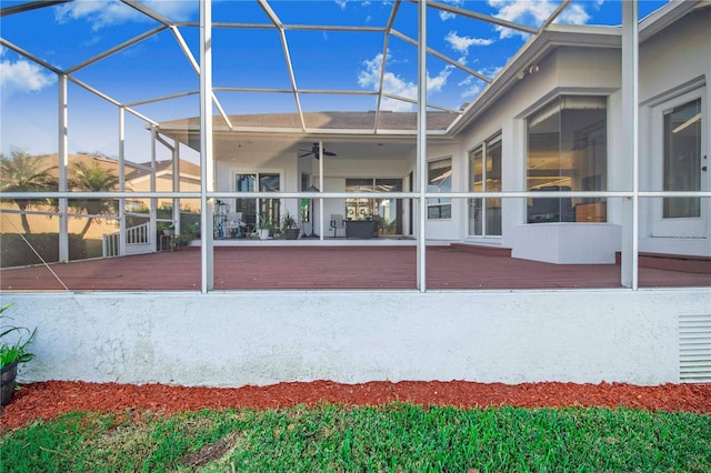 exterior space with ceiling fan and a lanai