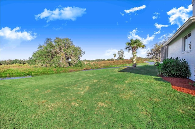 view of yard with a water view