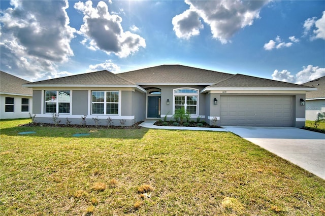 ranch-style home featuring a garage and a front lawn