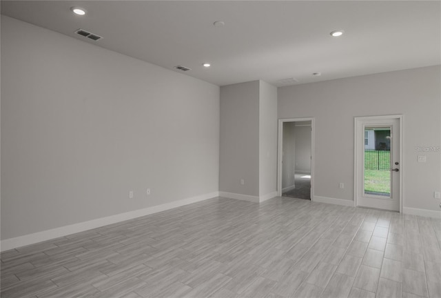 unfurnished room with light hardwood / wood-style floors