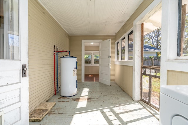 sunroom / solarium with washer / dryer and electric water heater