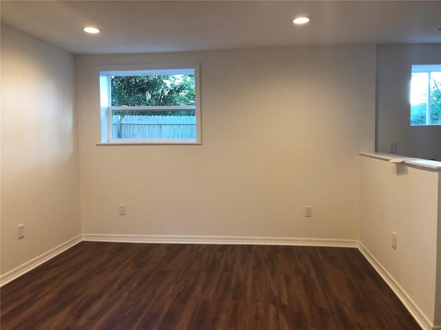 unfurnished room featuring dark hardwood / wood-style floors